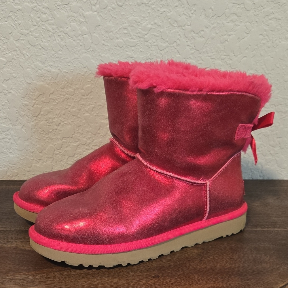 UGG Women's Mini Bailey Bow Glisten boots in Metallic "Radish"‎ pink suede.